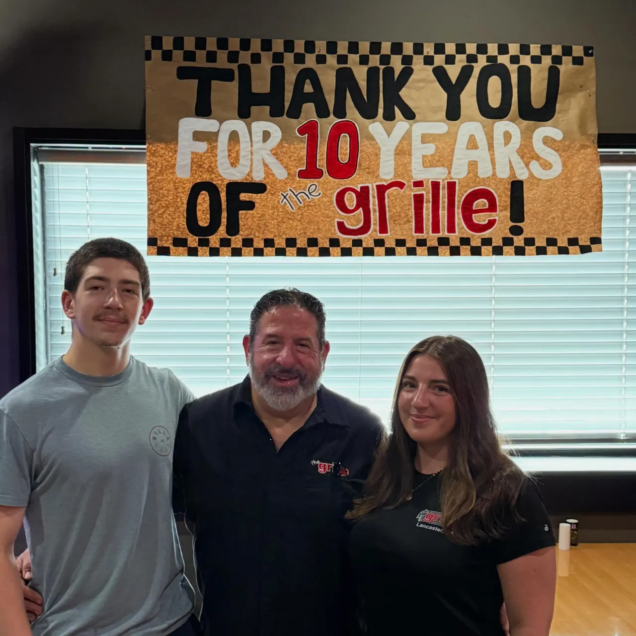 Owner George and his kids celebrating 10 years of The Grille